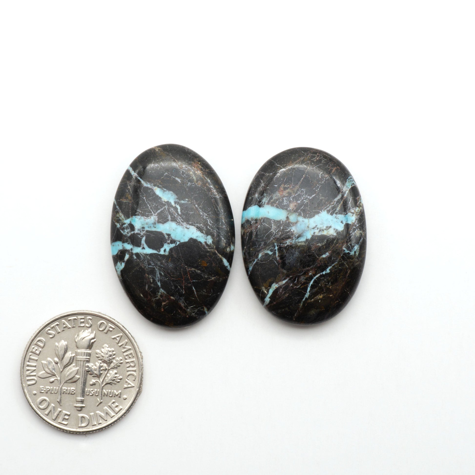 Black Jack Turquoise features a bold black color with striking veins of turquoise, making it a truly one-of-a-kind addition to your jewelry collection.