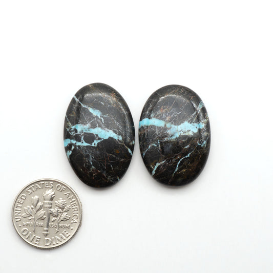 Black Jack Turquoise features a bold black color with striking veins of turquoise, making it a truly one-of-a-kind addition to your jewelry collection.