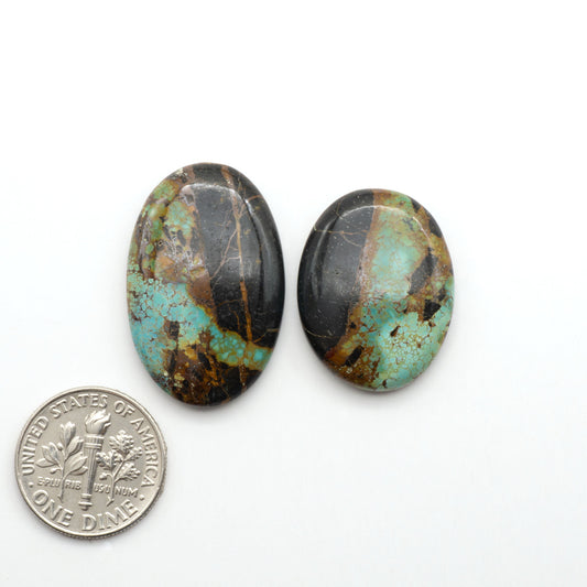 Black Jack Turquoise features a bold black color with striking veins of turquoise, making it a truly one-of-a-kind addition to your jewelry collection.