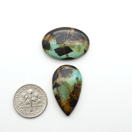 Black Jack Turquoise features a bold black color with striking veins of turquoise, making it a truly one-of-a-kind addition to your jewelry collection.