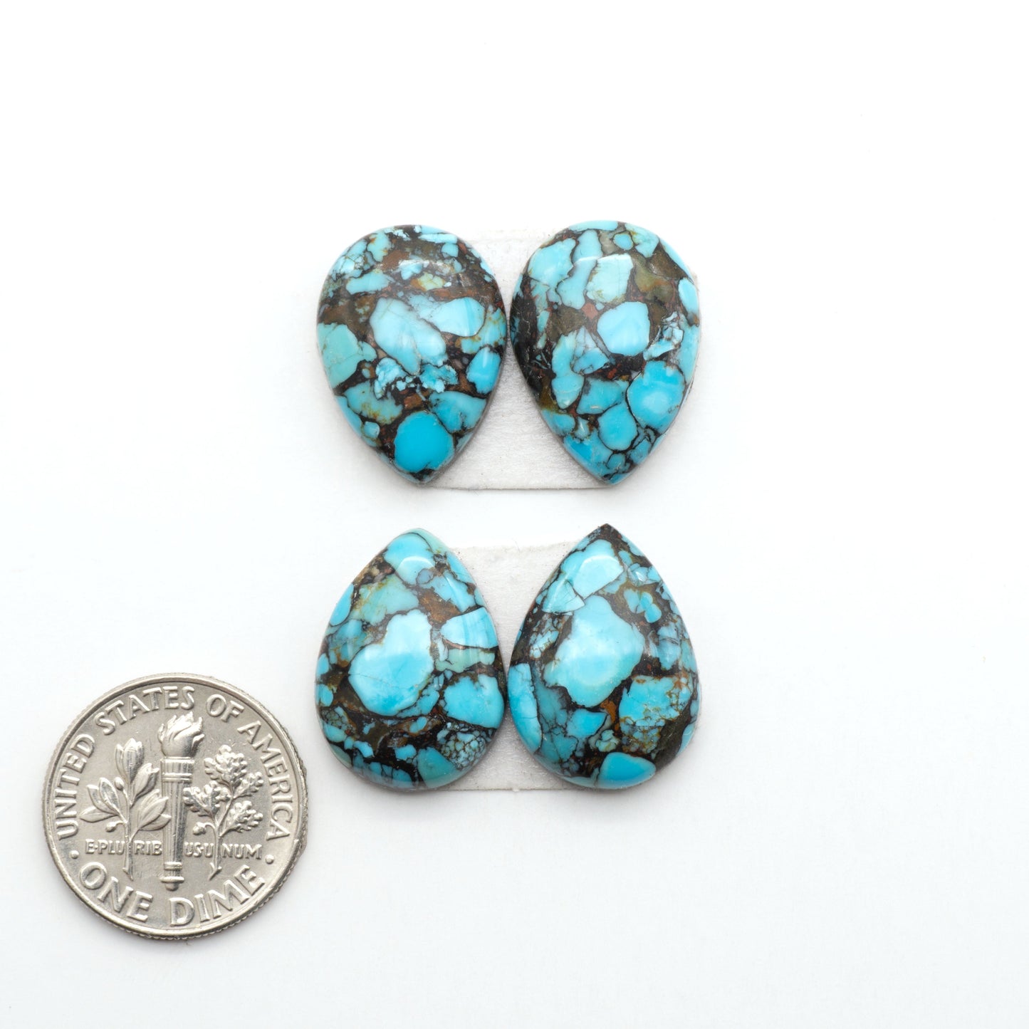 Enhance your jewelry designs with Pressed Turquoise Nugget Cabochons. Crafted from composite materials they add a captivating touch to your creations.