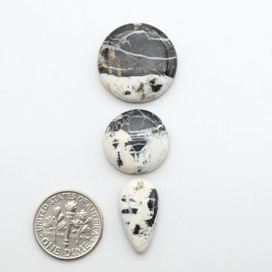 Natural White Buffalo Stone Cabochons are semi-precious gemstones cut into shapes ideal for jewelry-making, making them an excellent choice for artisans.