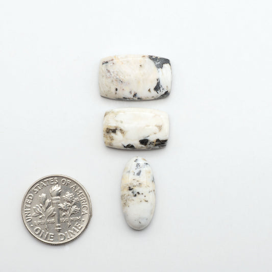 Natural White Buffalo Stone Cabochons are semi-precious gemstones cut into shapes ideal for jewelry-making, making them an excellent choice for artisans.