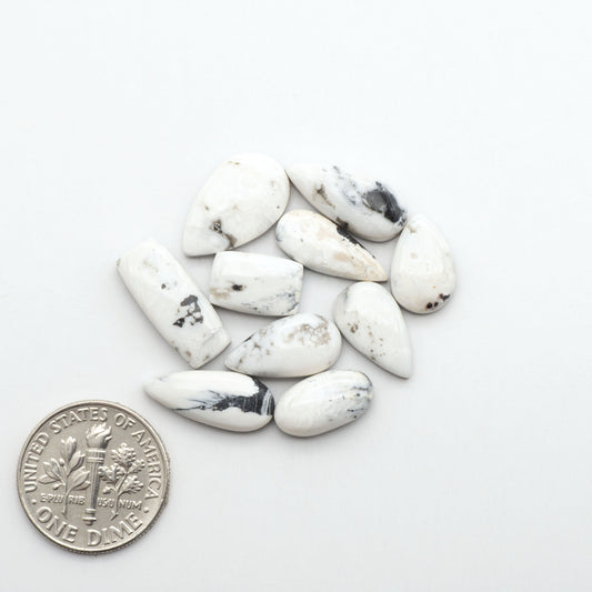 Natural White Buffalo Stone Cabochons are semi-precious gemstones cut into shapes ideal for jewelry-making, making them an excellent choice for artisans.