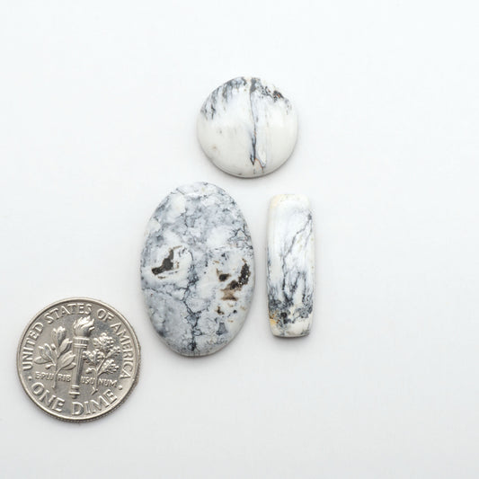 Natural White Buffalo Stone Cabochons are semi-precious gemstones cut into shapes ideal for jewelry-making, making them an excellent choice for artisans.