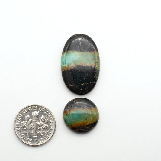 Black Jack Turquoise features a bold black color with striking veins of turquoise, making it a truly one-of-a-kind addition to your jewelry collection.