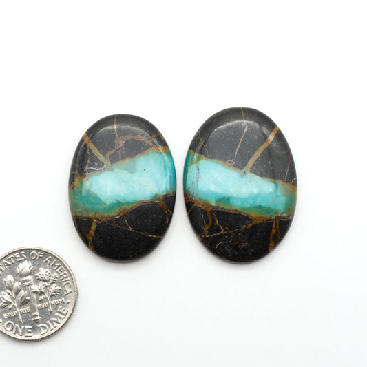 Black Jack Turquoise features a bold black color with striking veins of turquoise, making it a truly one-of-a-kind addition to your jewelry collection.
