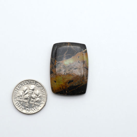 rectangle shaped black & green turquoise cabochons on a white background with a dime for scale.
