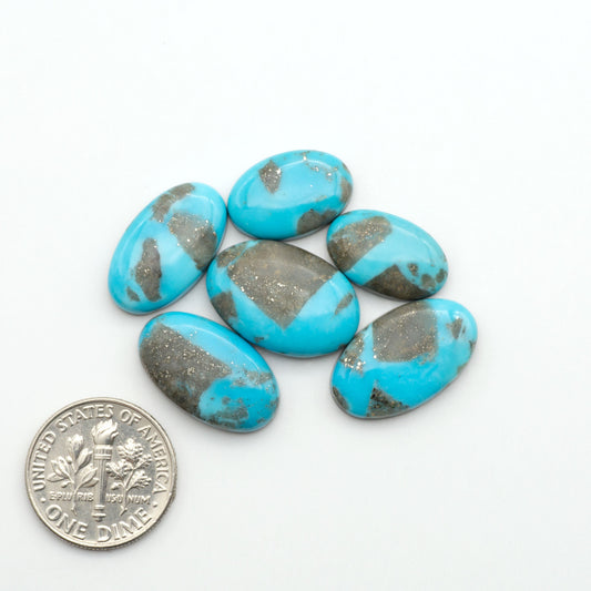 Nacozari turquoise cabochons are striking gemstones known for their vibrant blue to greenish-blue colors and pyrite, these stones are prized in jewelry making.
