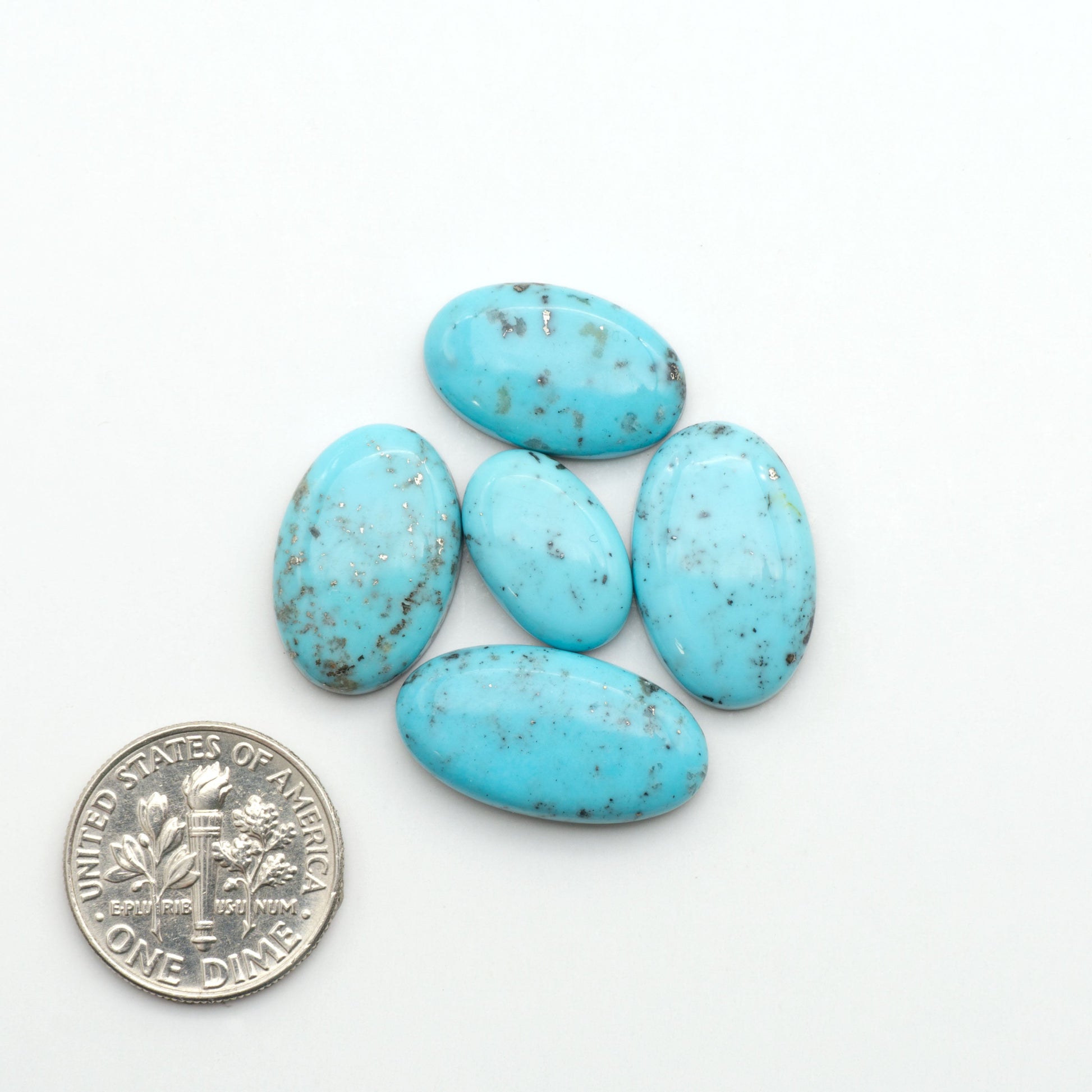 Nacozari turquoise cabochons are striking gemstones known for their vibrant blue to greenish-blue colors and pyrite, these stones are prized in jewelry making.