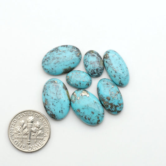 Nacozari turquoise cabochons are striking gemstones known for their vibrant blue to greenish-blue colors and pyrite, these stones are prized in jewelry making.