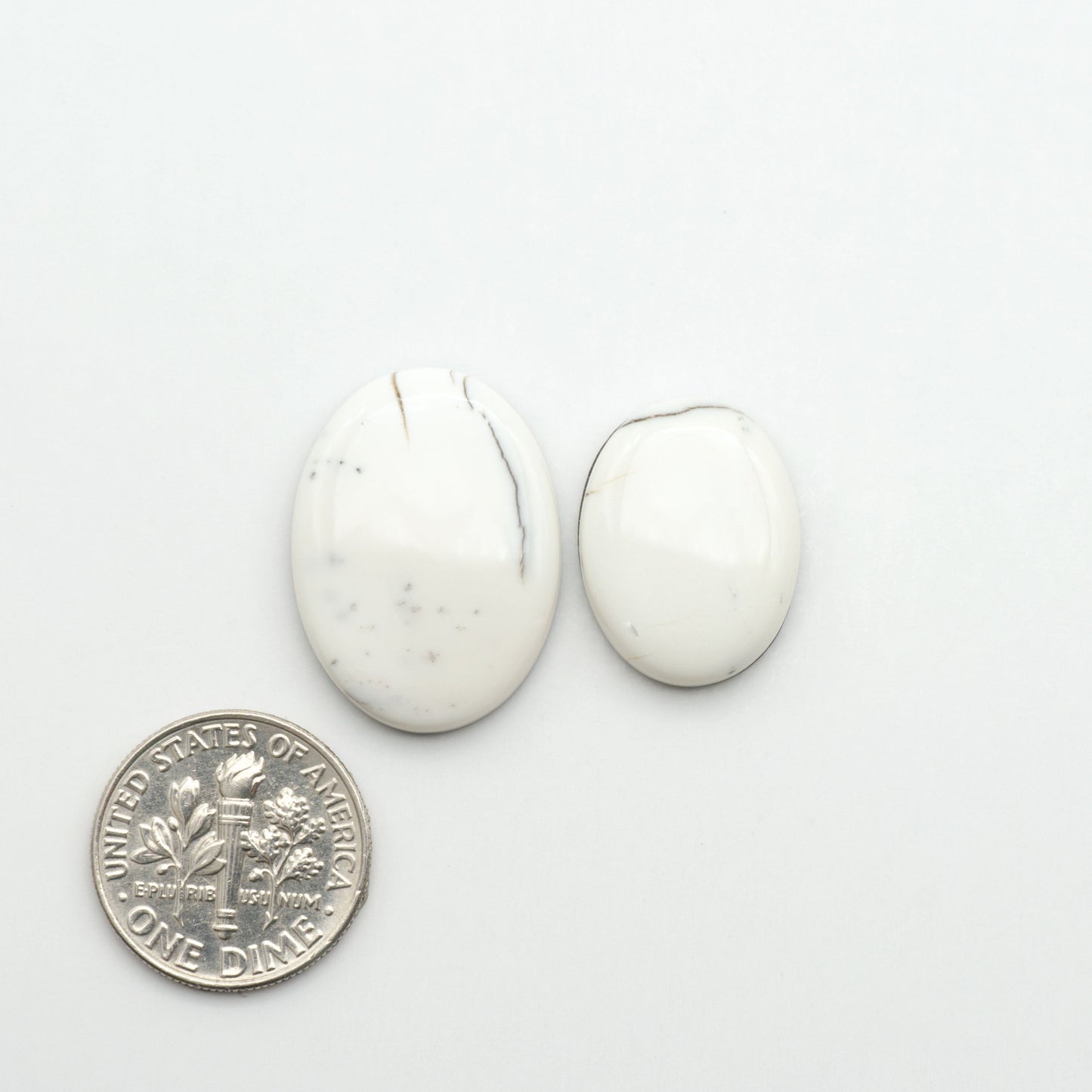 Natural White Buffalo Stone Cabochons are semi-precious gemstones cut into shapes ideal for jewelry-making, making them an excellent choice for artisans.