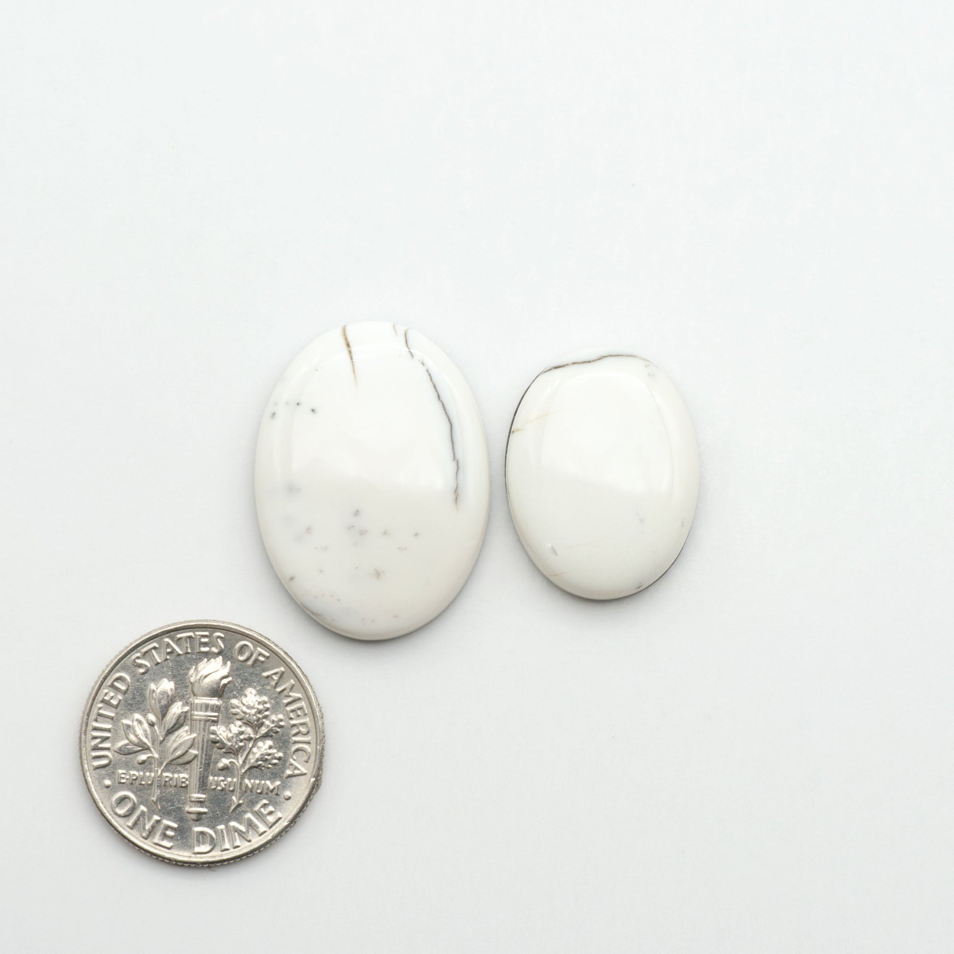 Natural White Buffalo Stone Cabochons are semi-precious gemstones cut into shapes ideal for jewelry-making, making them an excellent choice for artisans.