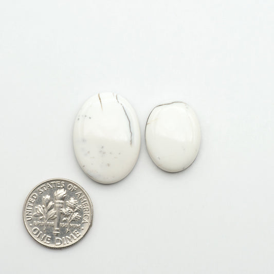 Natural White Buffalo Stone Cabochons are semi-precious gemstones cut into shapes ideal for jewelry-making, making them an excellent choice for artisans.