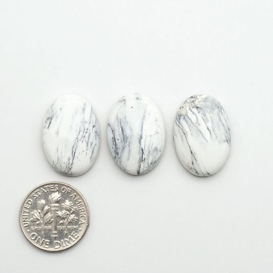 Natural White Buffalo Stone Cabochons are semi-precious gemstones cut into shapes ideal for jewelry-making, making them an excellent choice for artisans.
