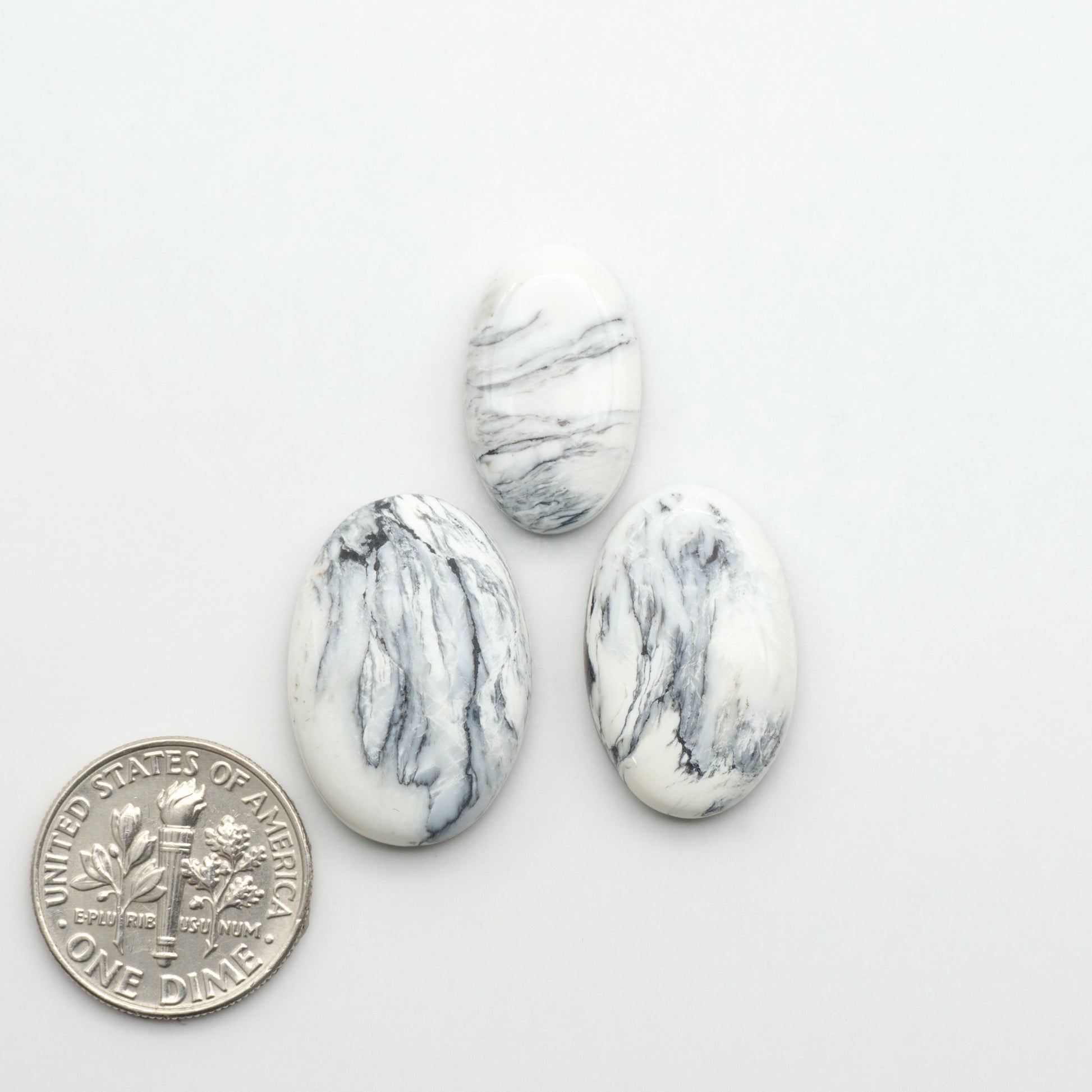 Natural White Buffalo Stone Cabochons are semi-precious gemstones cut into shapes ideal for jewelry-making, making them an excellent choice for artisans.