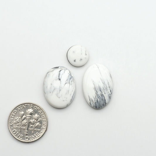 Natural White Buffalo Stone Cabochons are semi-precious gemstones cut into shapes ideal for jewelry-making, making them an excellent choice for artisans.