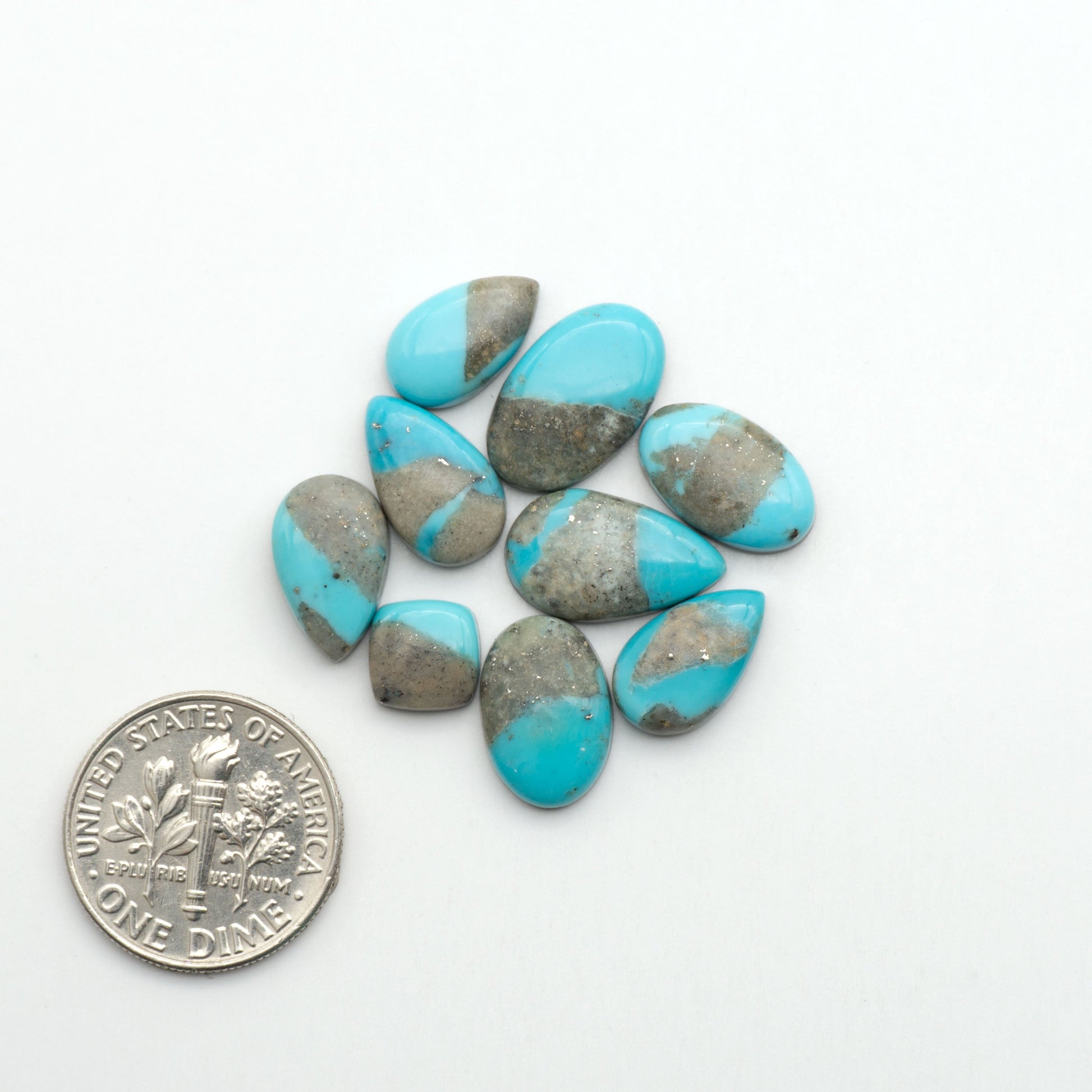 Nacozari turquoise cabochons are striking gemstones known for their vibrant blue to greenish-blue colors and pyrite, these stones are prized in jewelry making.