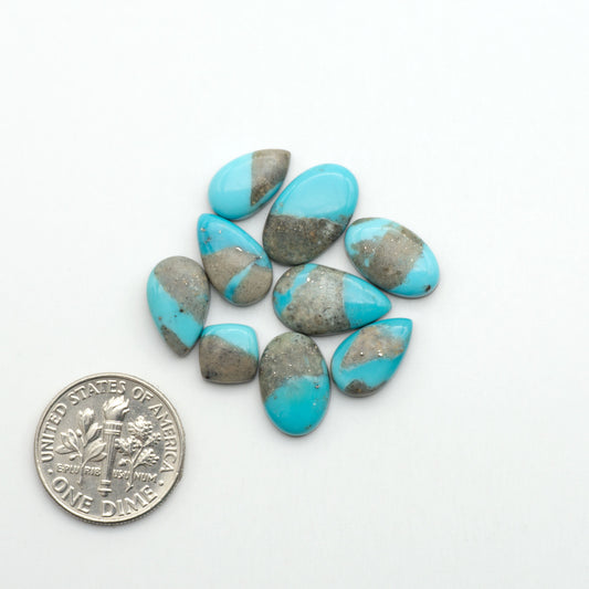 Nacozari turquoise cabochons are striking gemstones known for their vibrant blue to greenish-blue colors and pyrite, these stones are prized in jewelry making.