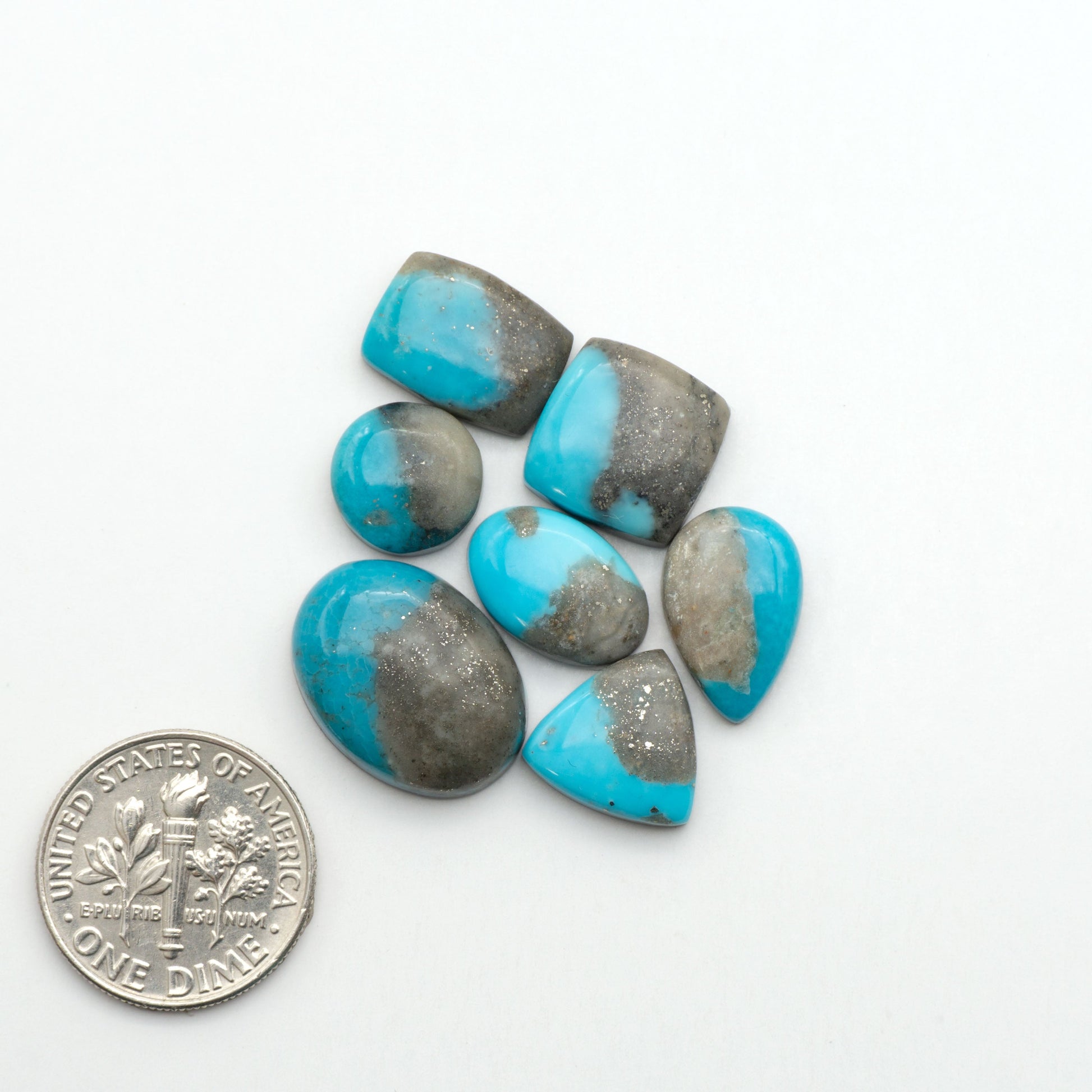 Nacozari turquoise cabochons are striking gemstones known for their vibrant blue to greenish-blue colors and pyrite, these stones are prized in jewelry making.