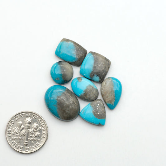 Nacozari turquoise cabochons are striking gemstones known for their vibrant blue to greenish-blue colors and pyrite, these stones are prized in jewelry making.