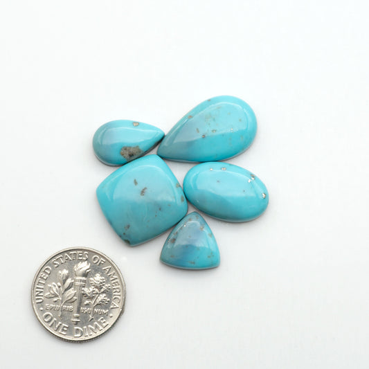 Nacozari turquoise cabochons are striking gemstones known for their vibrant blue to greenish-blue colors and pyrite, these stones are prized in jewelry making.