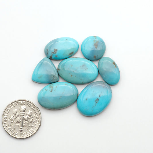 Nacozari turquoise cabochons are striking gemstones known for their vibrant blue to greenish-blue colors and pyrite, these stones are prized in jewelry making.