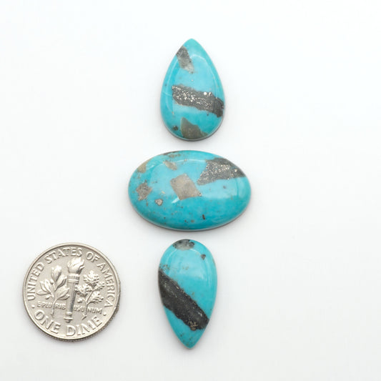 Nacozari turquoise cabochons are striking gemstones known for their vibrant blue to greenish-blue colors and pyrite, these stones are prized in jewelry making.