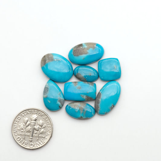 Nacozari turquoise cabochons are striking gemstones known for their vibrant blue to greenish-blue colors and pyrite, these stones are prized in jewelry making.