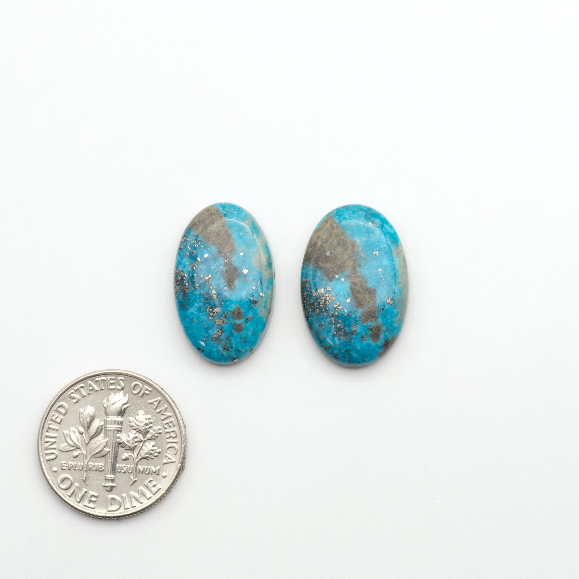 Nacozari turquoise cabochons are striking gemstones known for their vibrant blue to greenish-blue colors and pyrite, these stones are prized in jewelry making.