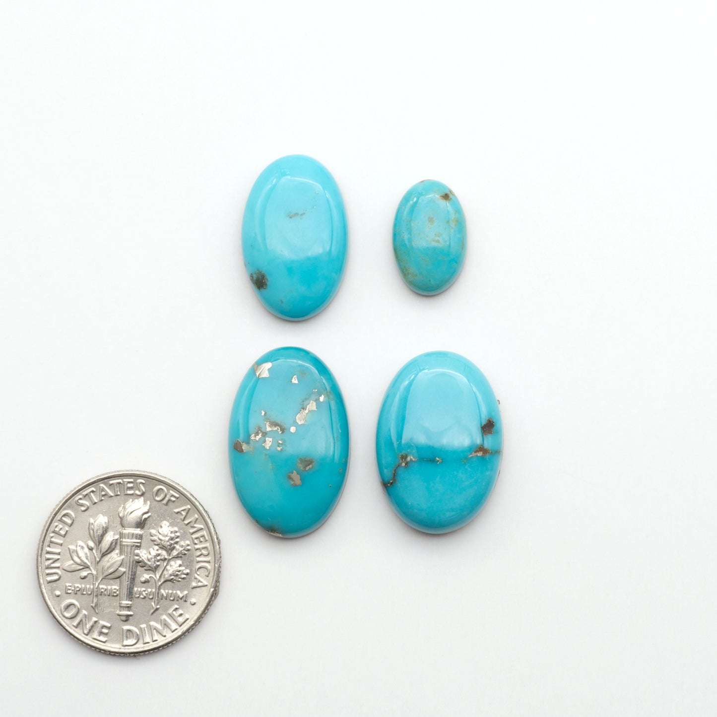 Nacozari turquoise cabochons are striking gemstones known for their vibrant blue to greenish-blue colors and pyrite, these stones are prized in jewelry making.