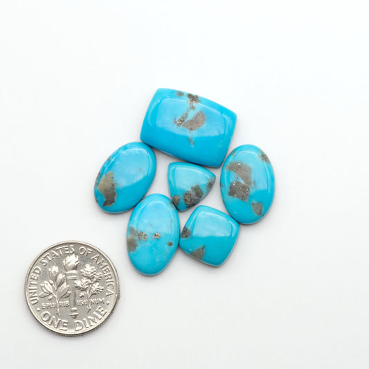 Nacozari turquoise cabochons are striking gemstones known for their vibrant blue to greenish-blue colors and pyrite, these stones are prized in jewelry making.