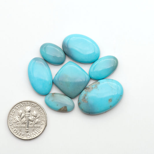 Nacozari turquoise cabochons are striking gemstones known for their vibrant blue to greenish-blue colors and pyrite, these stones are prized in jewelry making.