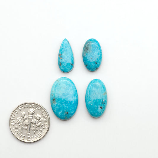 Nacozari turquoise cabochons are striking gemstones known for their vibrant blue to greenish-blue colors and pyrite, these stones are prized in jewelry making.