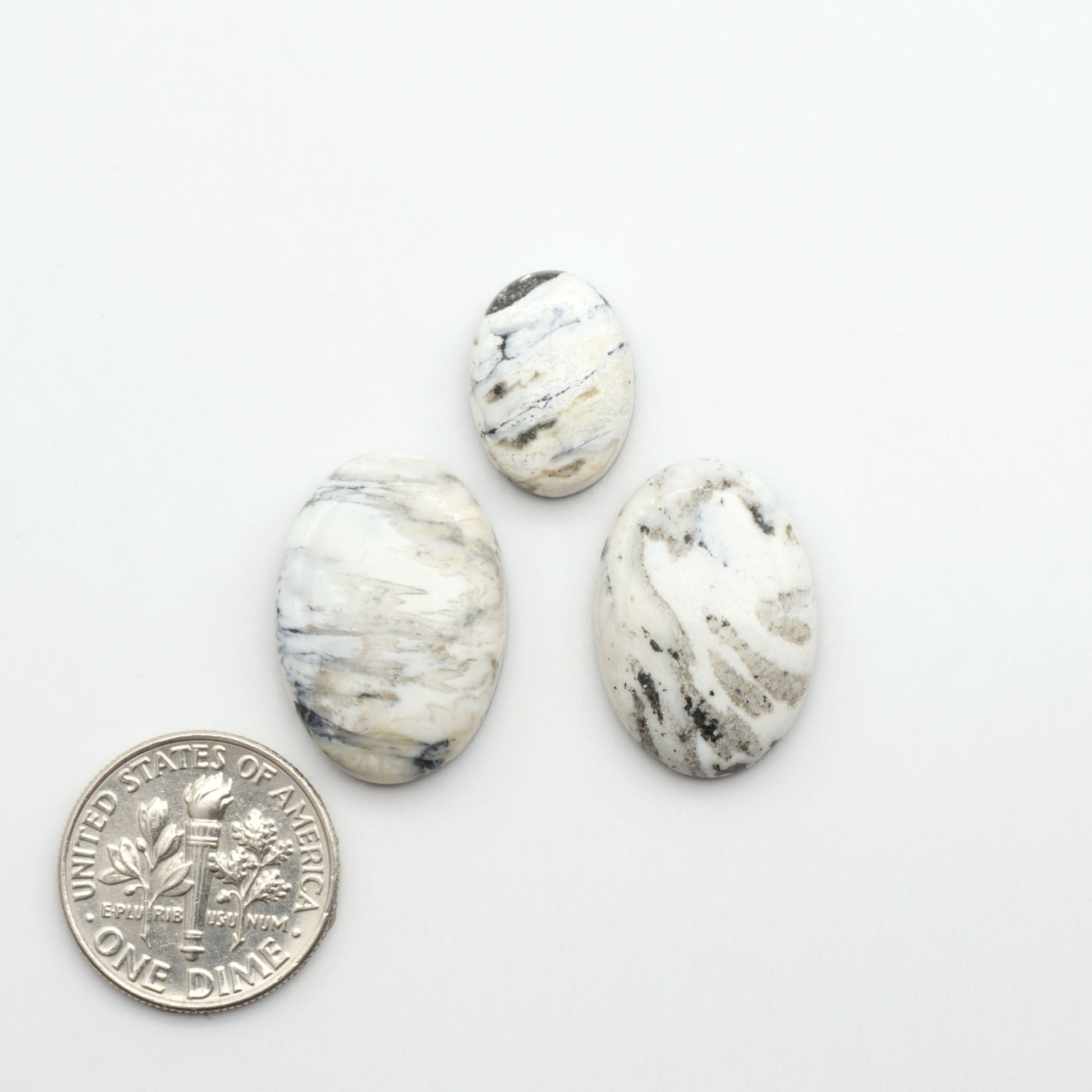 Natural White Buffalo Stone Cabochons are semi-precious gemstones cut into shapes ideal for jewelry-making, making them an excellent choice for artisans.