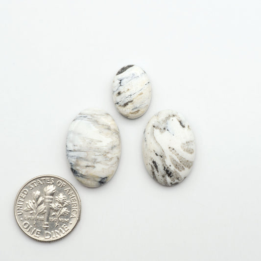 Natural White Buffalo Stone Cabochons are semi-precious gemstones cut into shapes ideal for jewelry-making, making them an excellent choice for artisans.