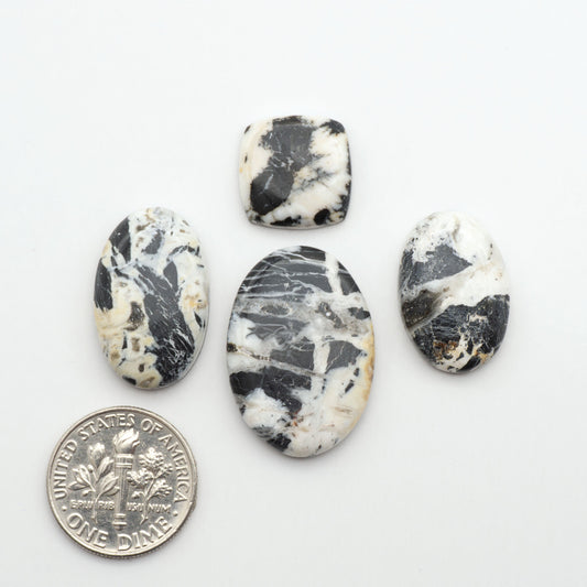 Natural White Buffalo Stone Cabochons are semi-precious gemstones cut into shapes ideal for jewelry-making, making them an excellent choice for artisans.