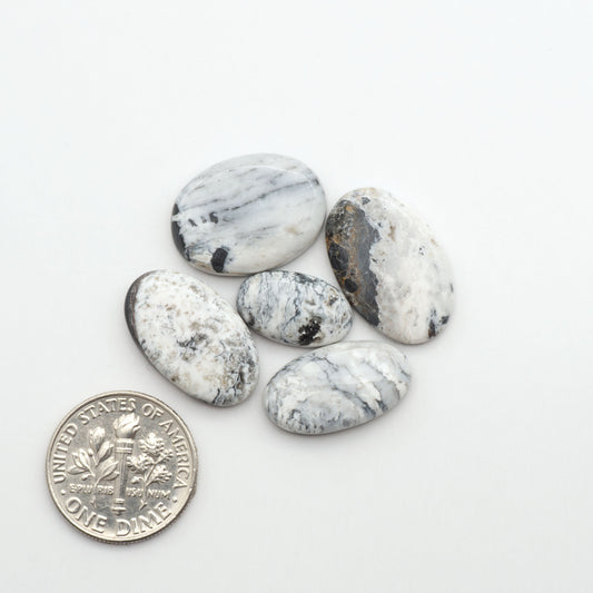 Natural White Buffalo Stone Cabochons are semi-precious gemstones cut into shapes ideal for jewelry-making, making them an excellent choice for artisans.