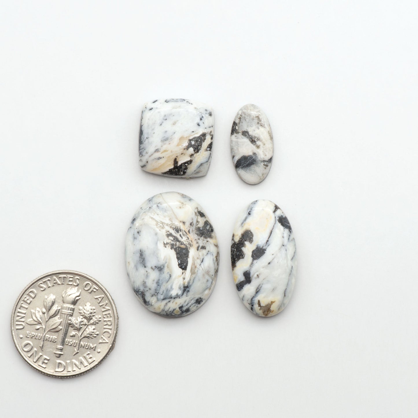 Natural White Buffalo Stone Cabochons are semi-precious gemstones cut into shapes ideal for jewelry-making, making them an excellent choice for artisans.
