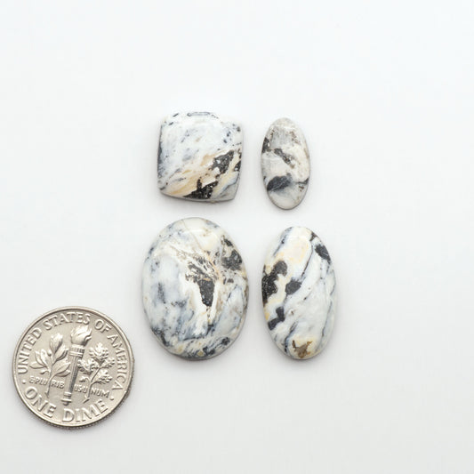 Natural White Buffalo Stone Cabochons are semi-precious gemstones cut into shapes ideal for jewelry-making, making them an excellent choice for artisans.
