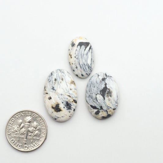 Natural White Buffalo Stone Cabochons are semi-precious gemstones cut into shapes ideal for jewelry-making, making them an excellent choice for artisans.