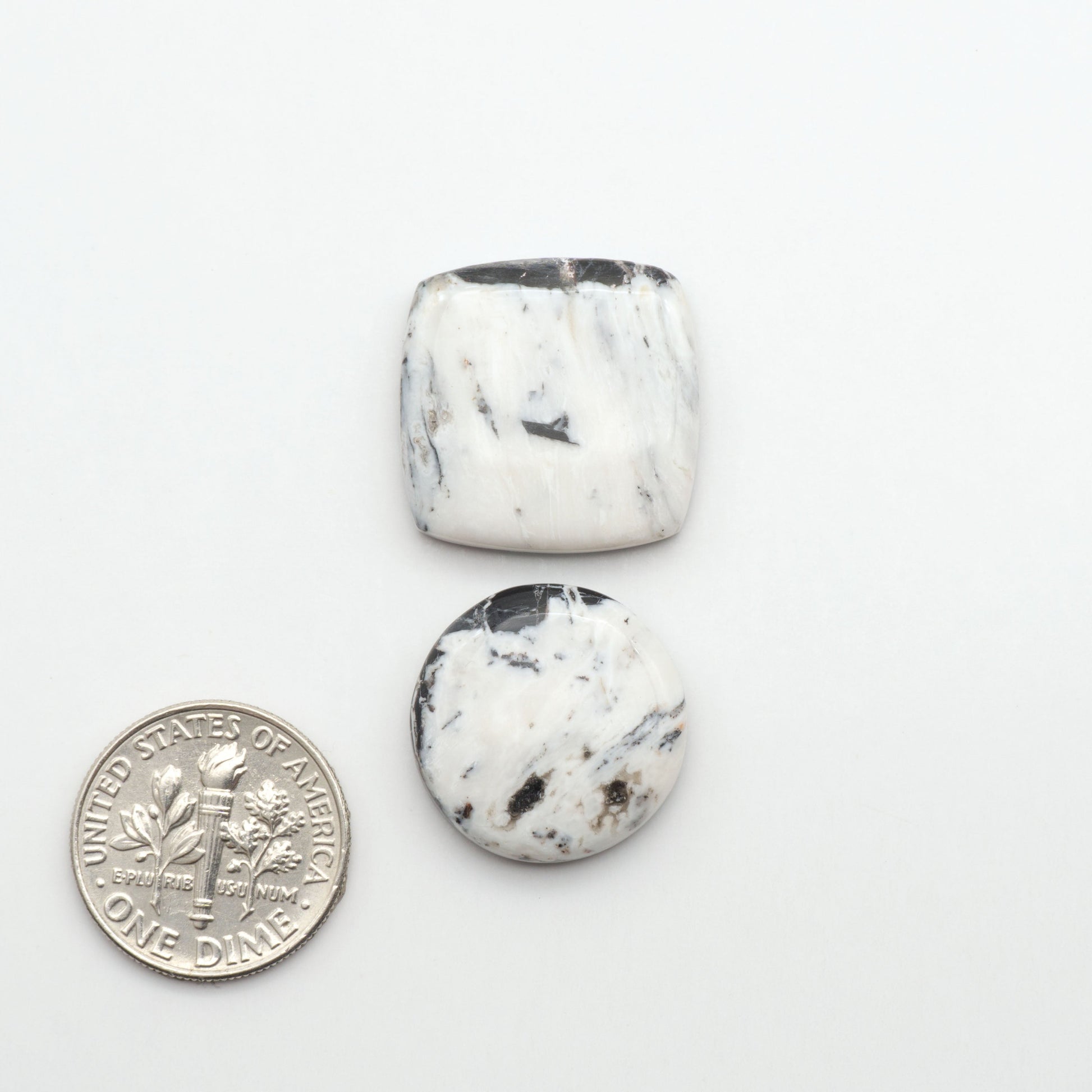 Natural White Buffalo Stone Cabochons are semi-precious gemstones cut into shapes ideal for jewelry-making, making them an excellent choice for artisans.