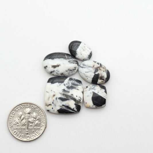 Natural White Buffalo Stone Cabochons are semi-precious gemstones cut into shapes ideal for jewelry-making, making them an excellent choice for artisans.