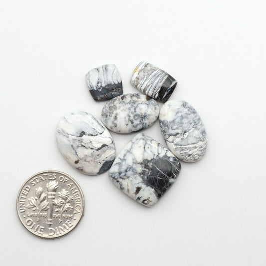 Natural White Buffalo Stone Cabochons are semi-precious gemstones cut into shapes ideal for jewelry-making, making them an excellent choice for artisans.