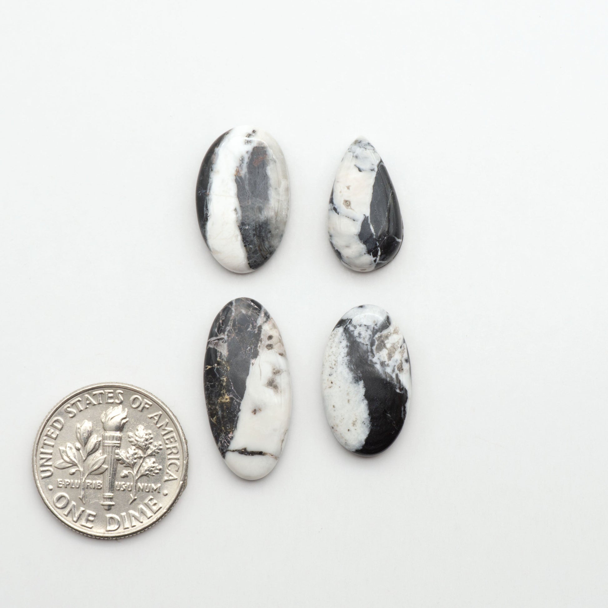 Natural White Buffalo Stone Cabochons are semi-precious gemstones cut into shapes ideal for jewelry-making, making them an excellent choice for artisans.