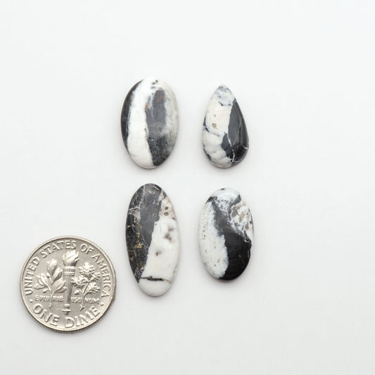 Natural White Buffalo Stone Cabochons are semi-precious gemstones cut into shapes ideal for jewelry-making, making them an excellent choice for artisans.