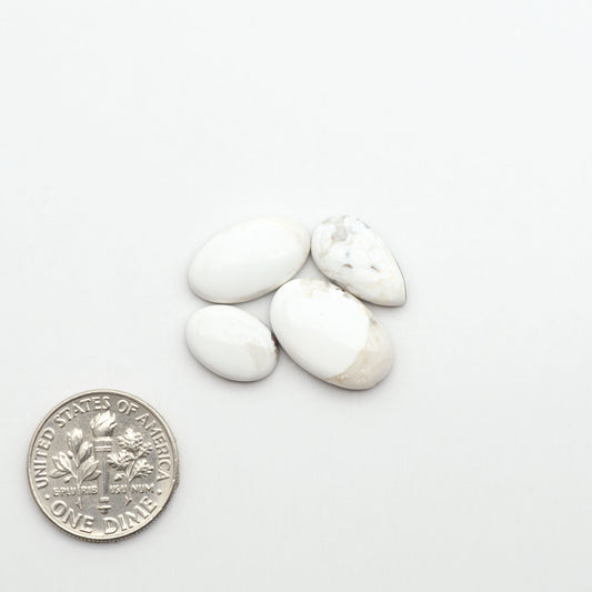 Natural White Buffalo Stone Cabochons are semi-precious gemstones cut into shapes ideal for jewelry-making, making them an excellent choice for artisans.