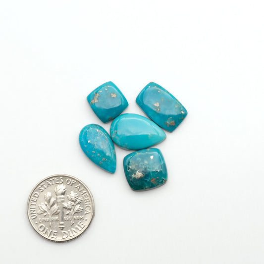 Nacozari turquoise cabochons are striking gemstones known for their vibrant blue to greenish-blue colors and pyrite, these stones are prized in jewelry making.