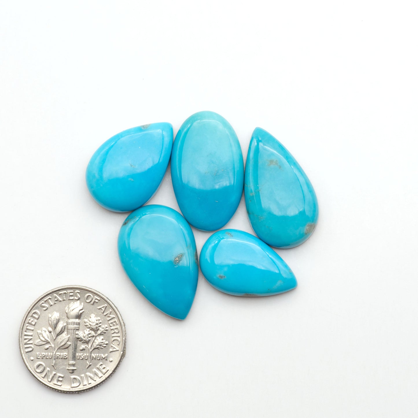 Nacozari turquoise cabochons are striking gemstones known for their vibrant blue to greenish-blue colors and pyrite, these stones are prized in jewelry making.