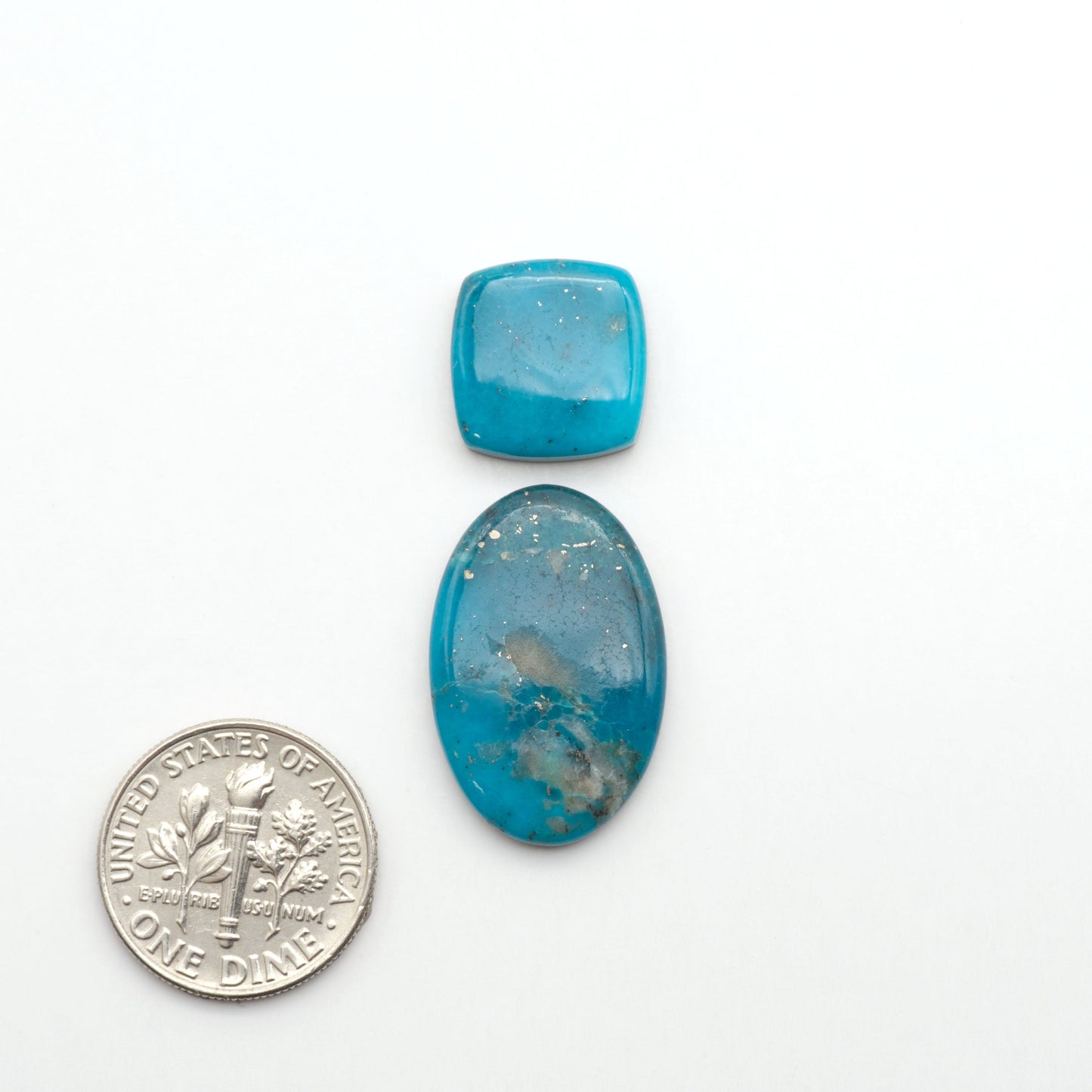 Nacozari turquoise cabochons are striking gemstones known for their vibrant blue to greenish-blue colors and pyrite, these stones are prized in jewelry making.